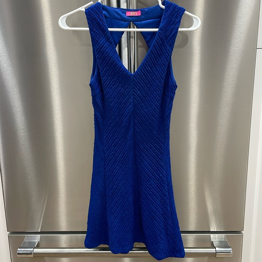 Gorgeous Royal Blue Flow Dress with Back cut out.